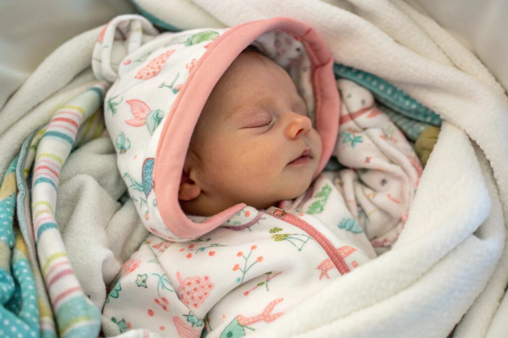 Baby in animal-print hoodie