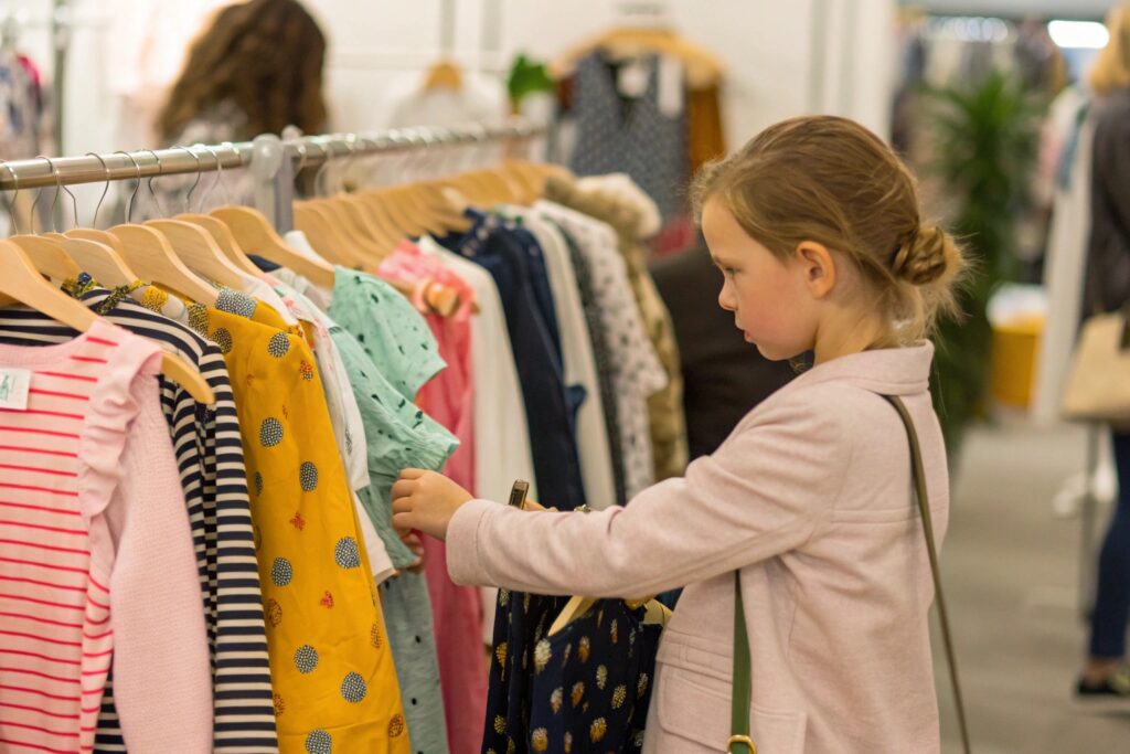 Retailer browsing kidswear collection