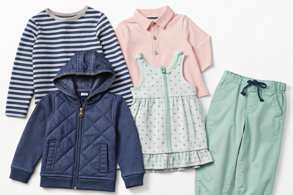 Variety of children’s clothing laid out