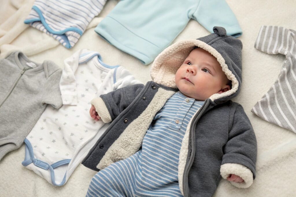 A baby wearing a cozy hoodie and onesie