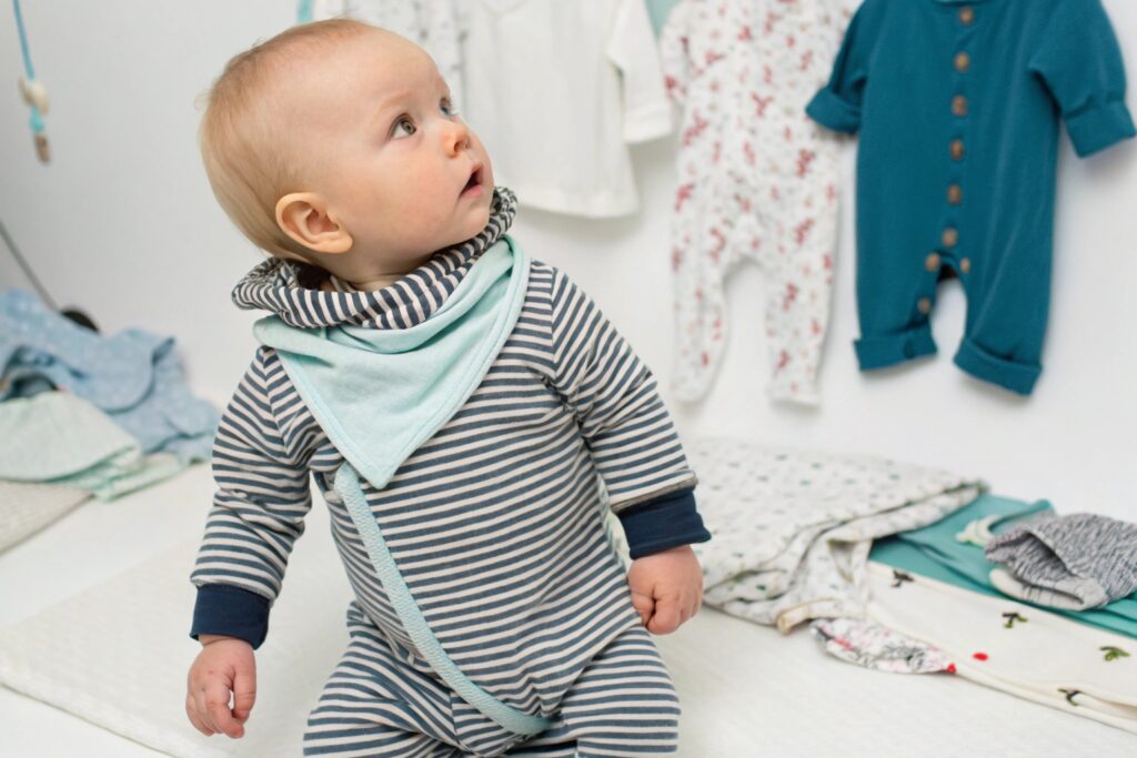 Baby wearing a custom-designed babywear outfit