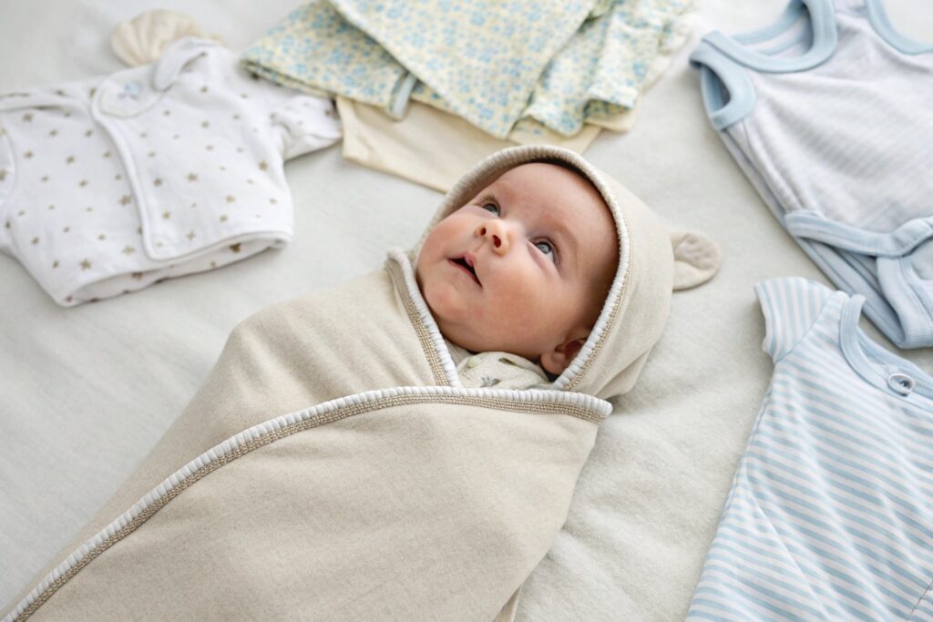 Baby wearing a soft Burt's Bees Baby sleep sack