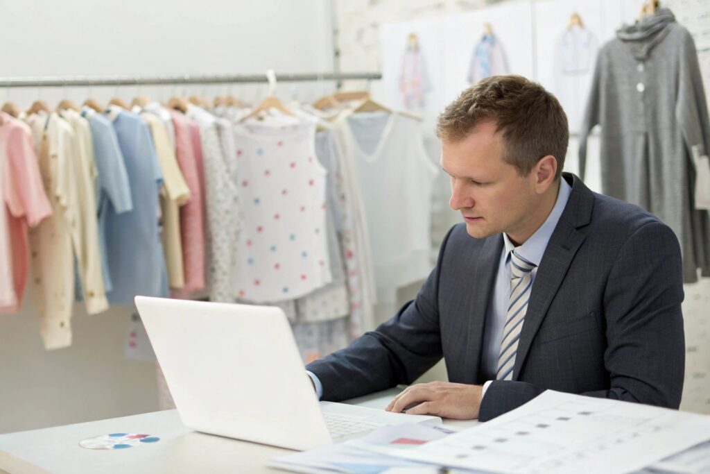 European brand manager reviewing sales data and designs