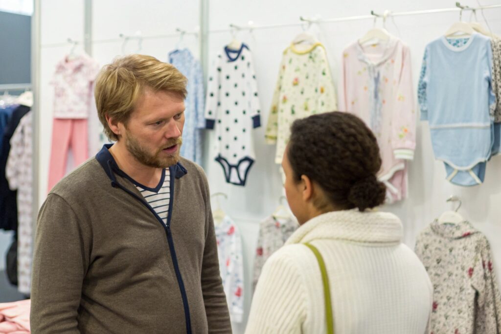 Buyer discussing certifications and production capacity at a trade fair