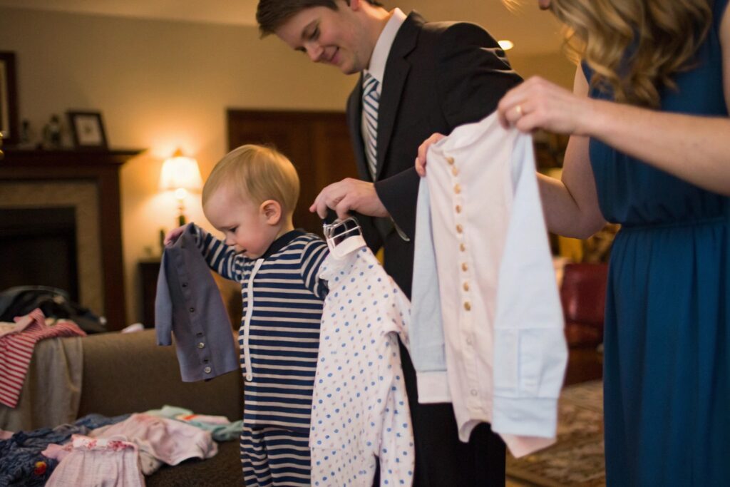 European Child Picking Out an Outfit for a Family Member