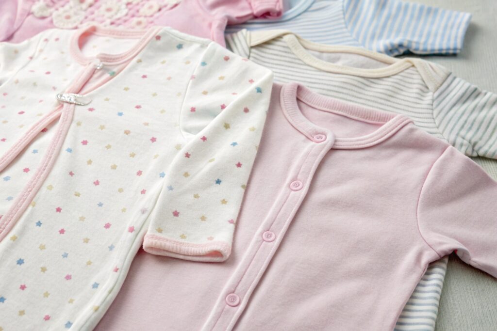 Close-up of babywear collection showing different styles