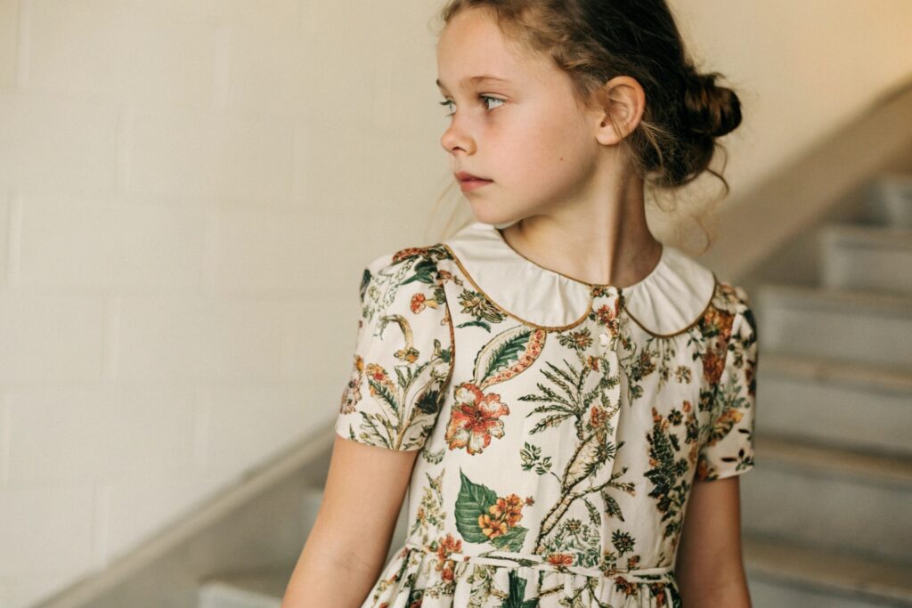 Close-up of European girl wearing a floral dress