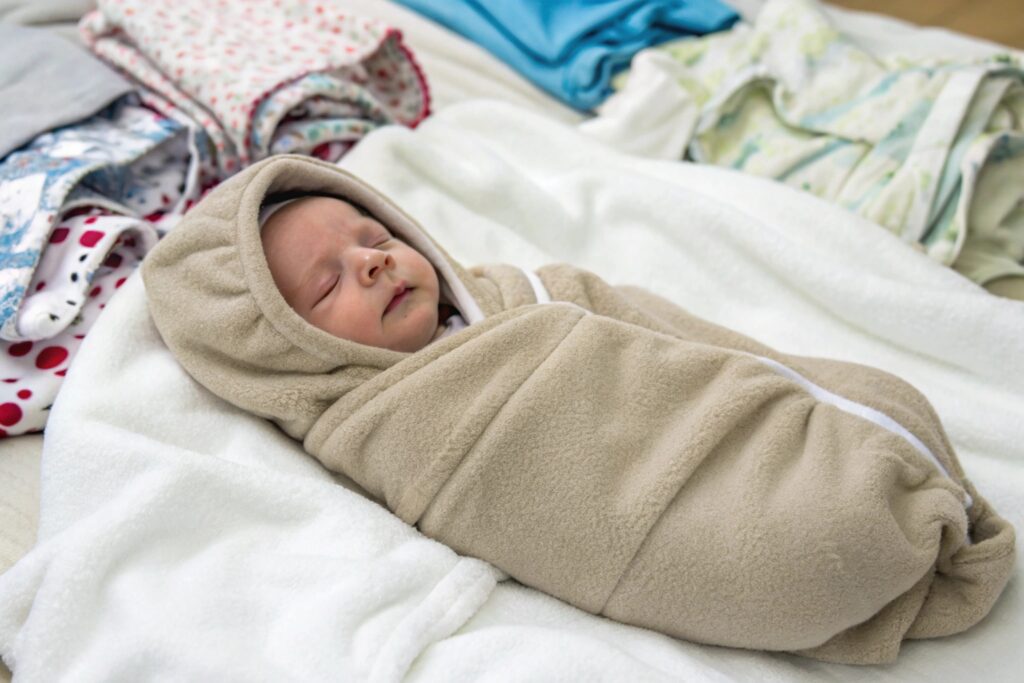 Newborn snugly wrapped in a soft fleece