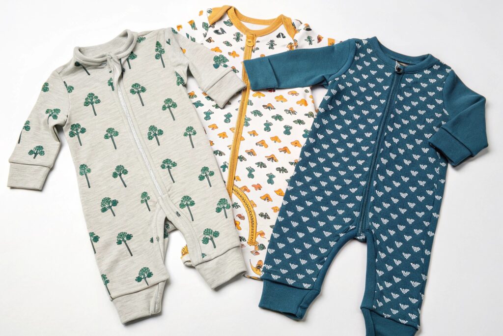 Set of Custom Babywear Garments Displayed with Various Prints