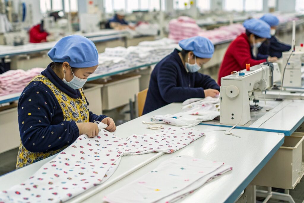 Babywear manufacturer adding finishing touches