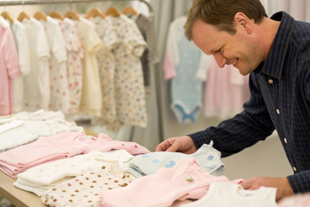 A business owner browsing baby clothing designs