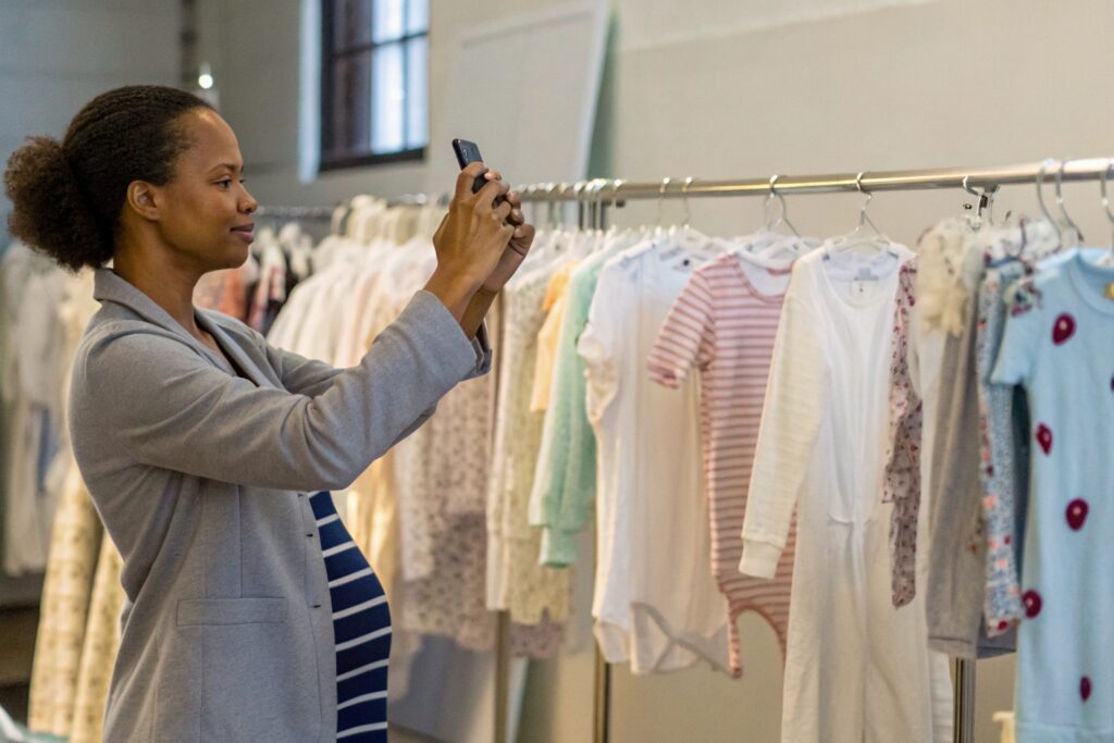 Business owner working on the phone in a clothing store