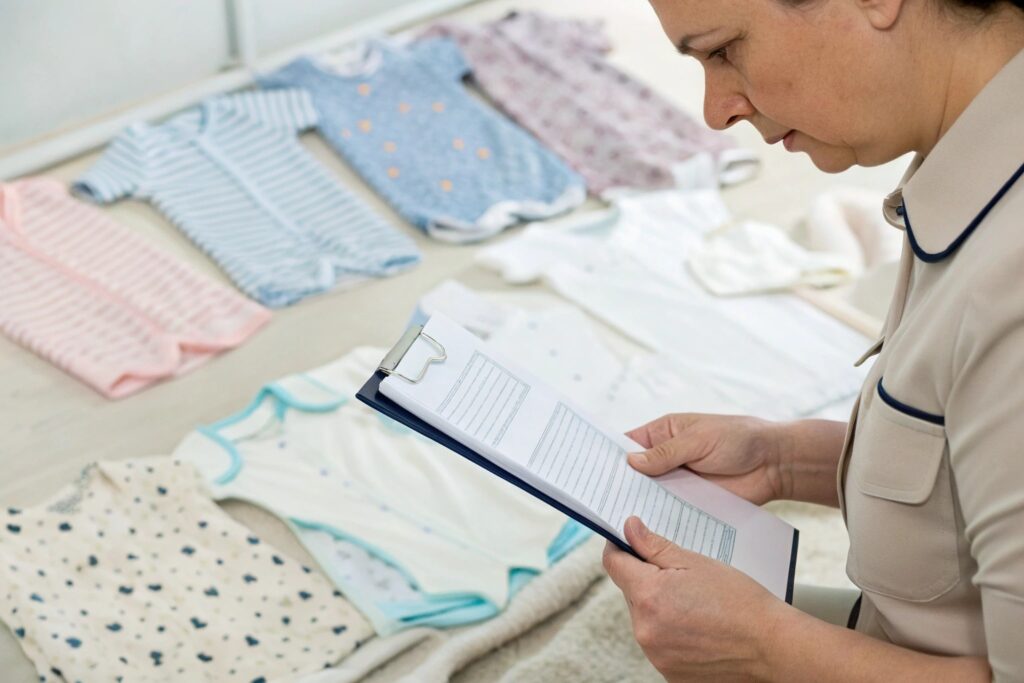 Compliance officer reviewing baby clothes