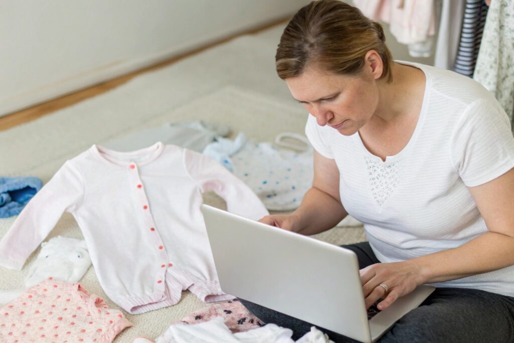 Parent Calculating the Price of Babywear