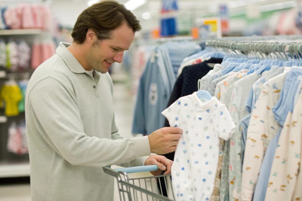 Parent shopping at Walmart for kids' clothes