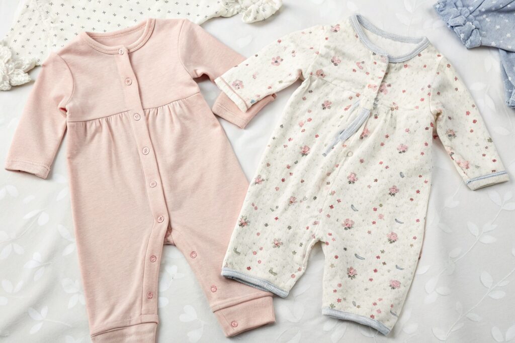 Two baby outfits side by side