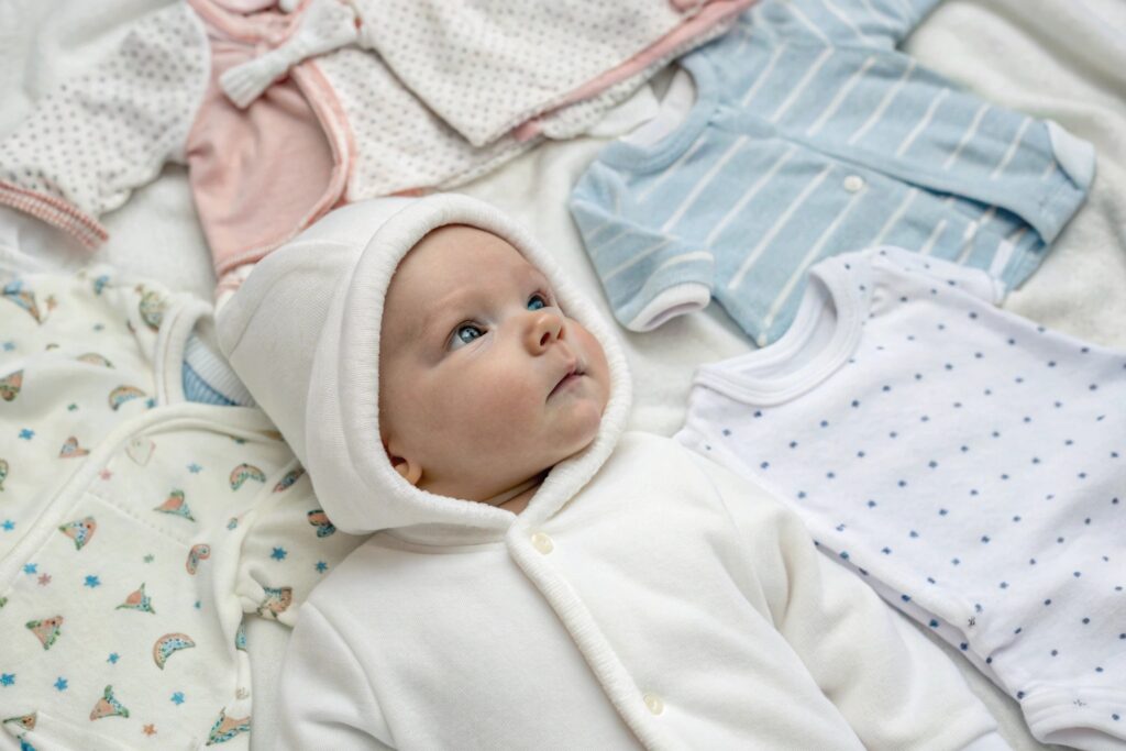 Baby wearing soft organic clothing in a peaceful setting