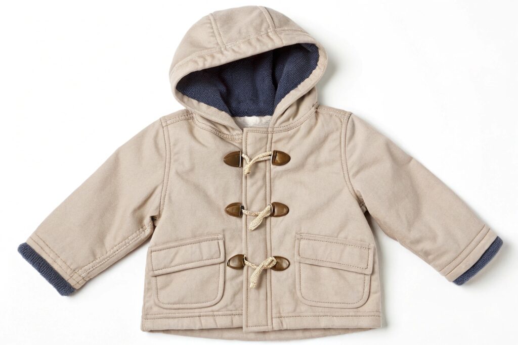Beige children's jacket with buttons and hood